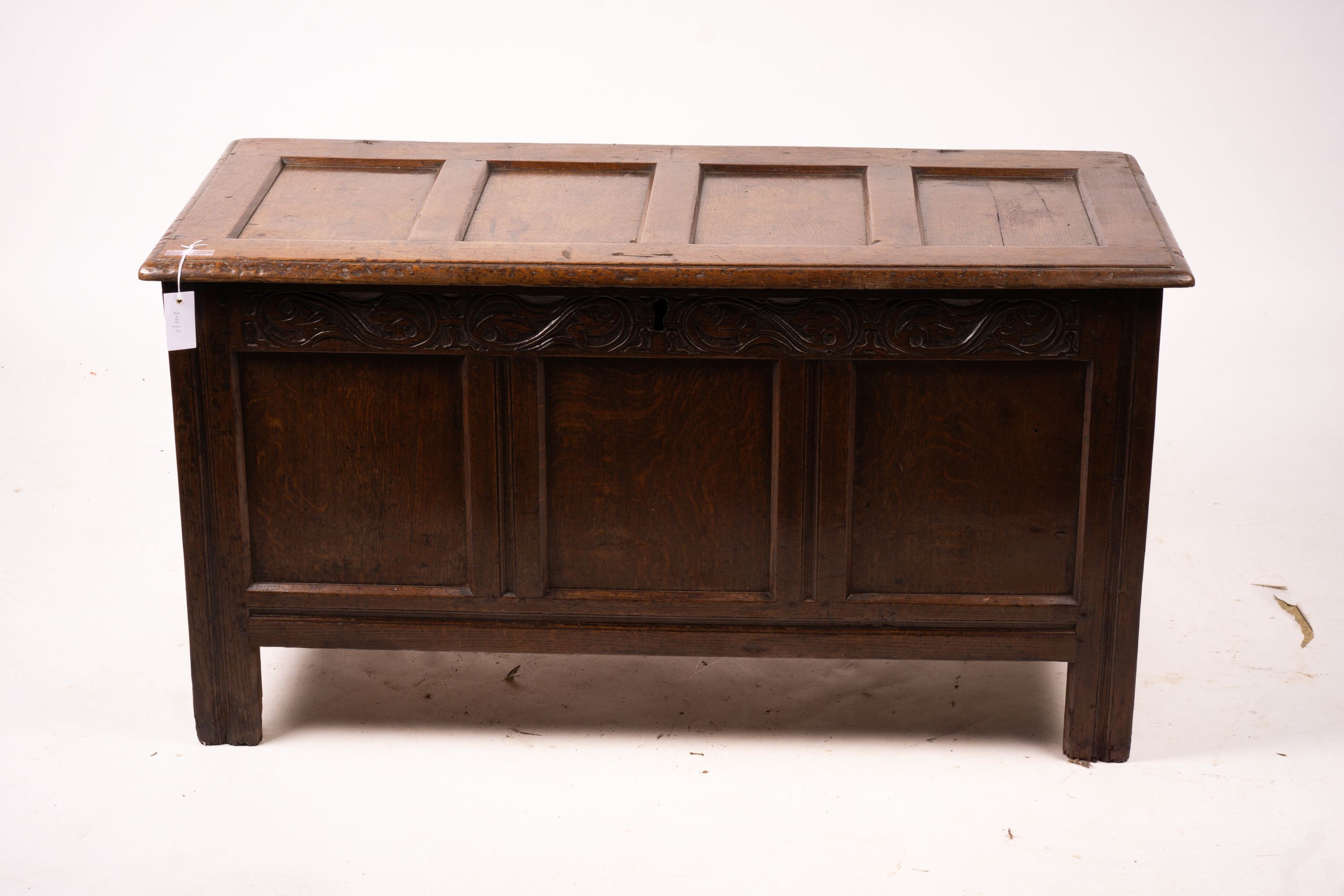 A 17th century panelled oak coffer, W.122cm D.55cm H.65cm